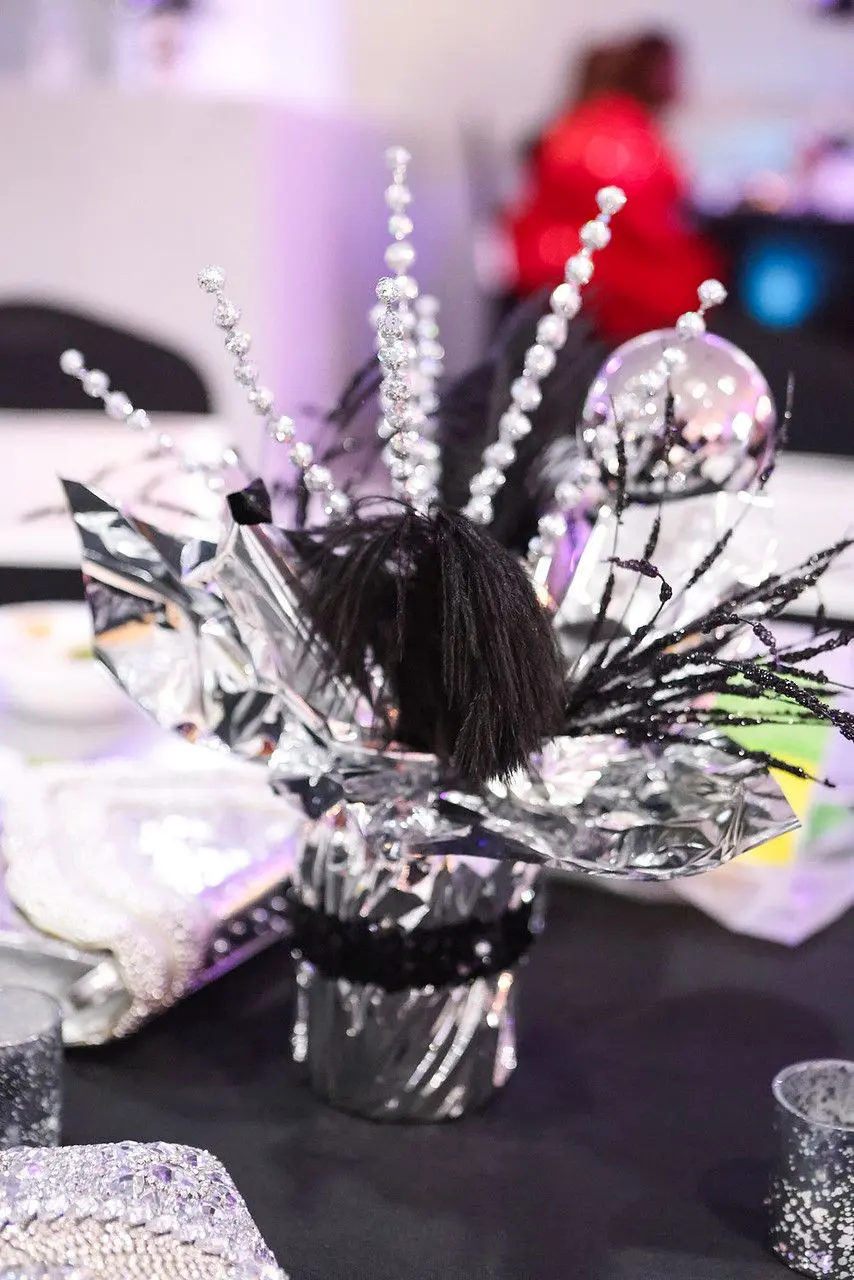 Black and silver spray centerpiece with crystals on a table at The Heights